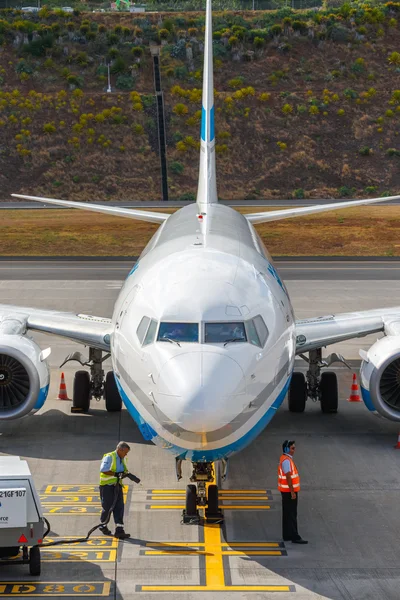 Funchal, Madeira - July 6, 2016: Enter Air Boeing 737 at Funchal Cristiano Ronaldo Airport, boarding passengers.This airport is one of the most dangerous airports in Europe