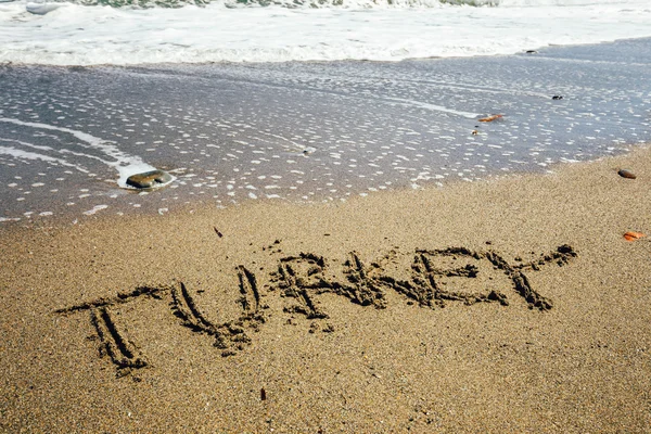 Η λέξη Τουρκία γραμμένο στην άμμο στην παραλία — Φωτογραφία Αρχείου