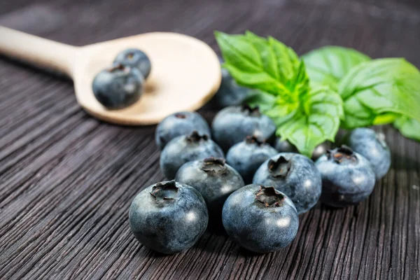 Blueberry on wooden board — Stock Photo, Image