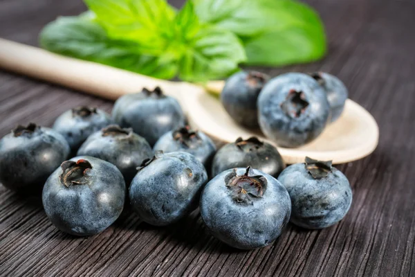 Blueberry on wooden board — Stock Photo, Image