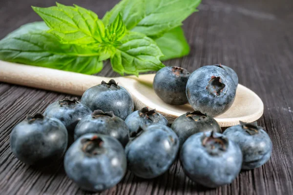 Blueberry on wooden board — Stock Photo, Image