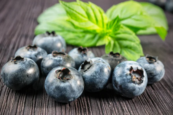 Blueberry on wooden board — Stock Photo, Image