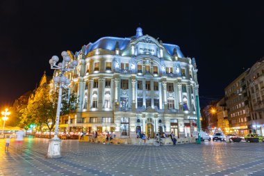 ROMANIA, TIMISOARA - JULY 22: Night view of city center in Timisoara on July 22, 2014, Romania. Timisoara is the 3rd largest city and popular tourist place. clipart