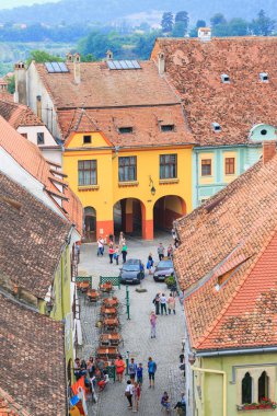 SIGHISOARA, ROMANIA - JULY 17: Aerial view of Old Town in Sighisoara, major tourist attraction on July 17, 2014. City in which was born Vlad Tepes, Dracula clipart