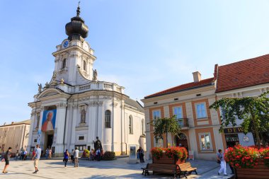 Wadowice, Poland - September 07, 2014: Tourists visit the city center of Wadowice. Wadowice is the place of birth of Pope John Paul II clipart