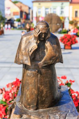 Wadowice, Poland - September 07, 2014: Sculpture of Pope John Paul II in the city center of Wadowice, the place of birth of Pope John Paul II clipart