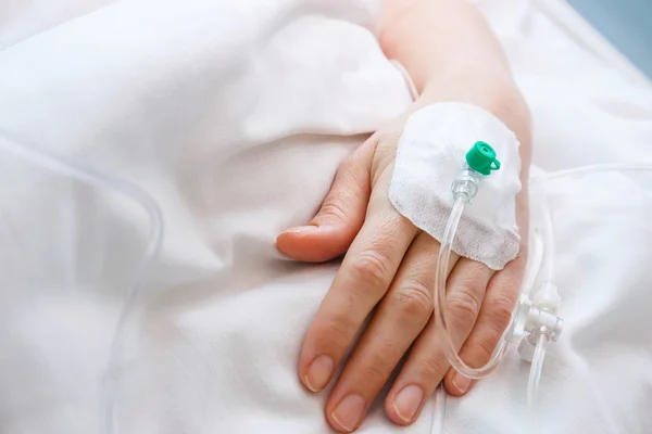 Close up of a iv drip in patient's hand — Stock Photo, Image