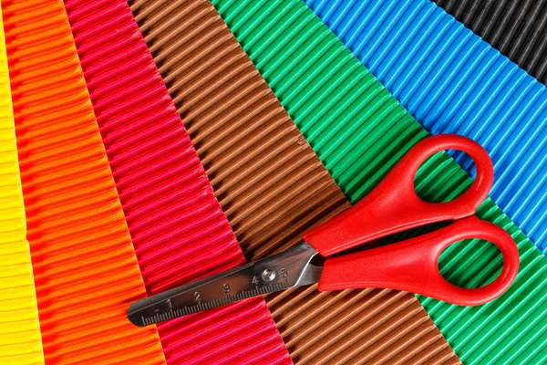 Scissors on colorful cardboard — Stock Photo, Image