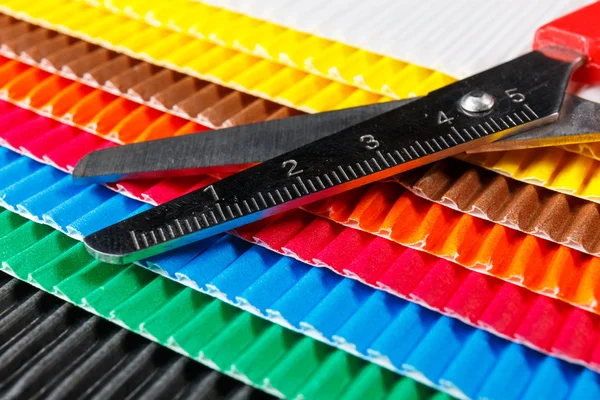 Scissors on colorful cardboard — Stock Photo, Image