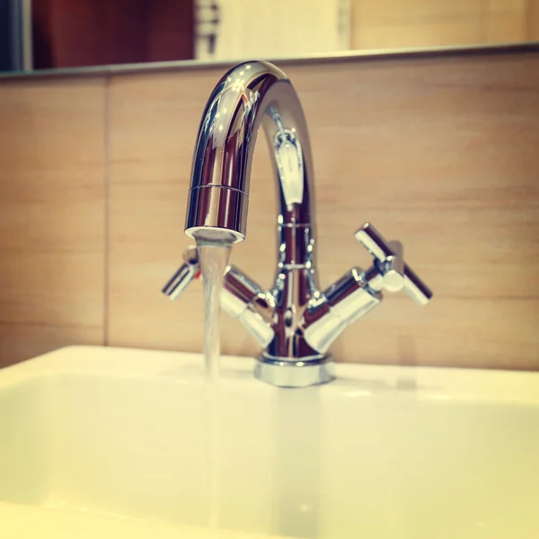 Water tap with modern design in bathroom, vintage look — Stock Photo, Image