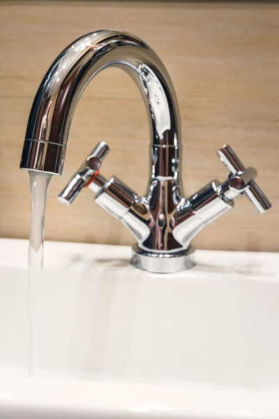 water tap with modern design in bathroom