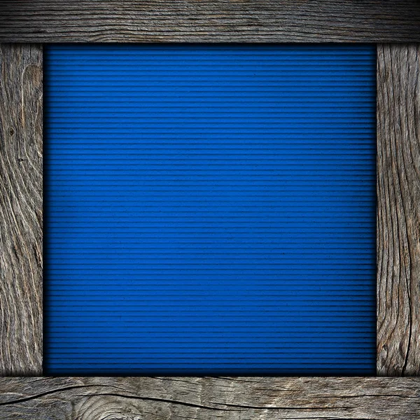 Wood frame with blue paper — Stock Photo, Image