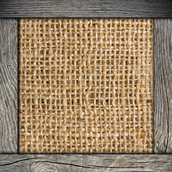 Background of crumpled burlap with wood frame — Stock Photo, Image