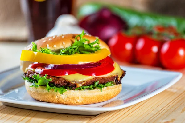 Hamburger and drink with slice of lemon — Stock Photo, Image