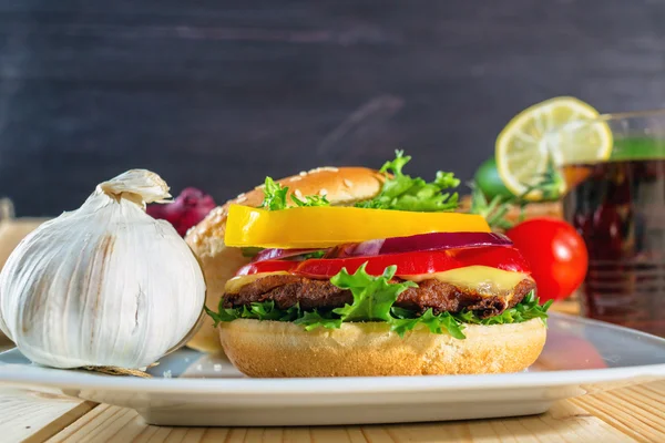 Close up of homemade hamburger on white plate — Stock Photo, Image