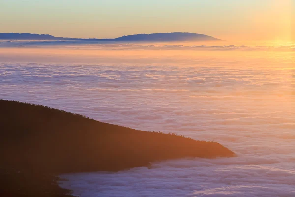 Aerial view over clouds above ocean water with last sunshine, Tenerife, Canary Islands, Spain — Stock Photo, Image