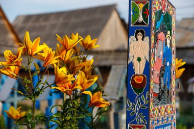 SAPANTA,ROMANIA - 04 JULY, 2015- The merry cemetery of Sapanta, Maramures, Romania. Those cemetery is unique in Romania and in the world. clipart