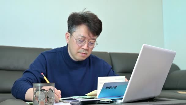Middle Aged Asian Man Preparing Tax Return — Stock Video