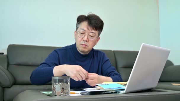 Middle Aged Asian Man Preparing Tax Return — Stock Video