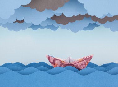 Euro tekne fırtınada. Kağıt dalgalar ve bulutlar