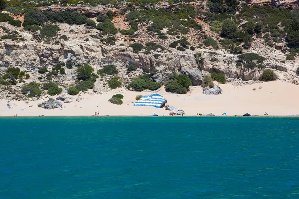 Tsambika beach with Greece flag, Rhodes island — Stock Photo, Image