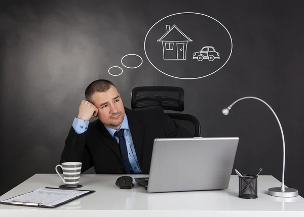 Businessman dreaming in office — Stock Photo, Image