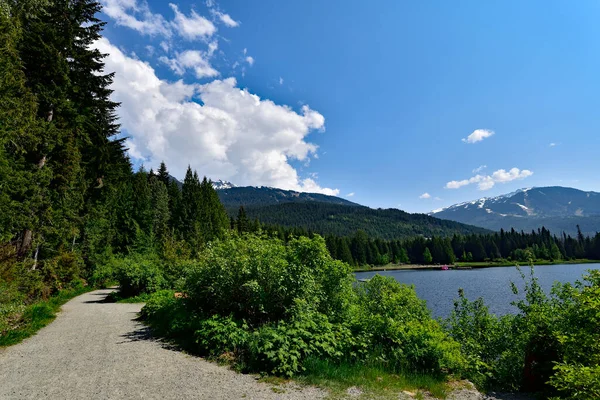 A gravel trail around the Lost Lake in Whistler, Canada, great place for swimming, fishing, floating, hiking and biking