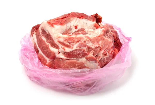 Carne de cerdo en bolsa plástica aislada sobre blanco — Foto de Stock