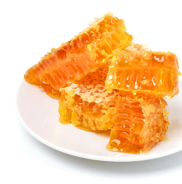 Honeycomb close on the plate — Stock Photo, Image