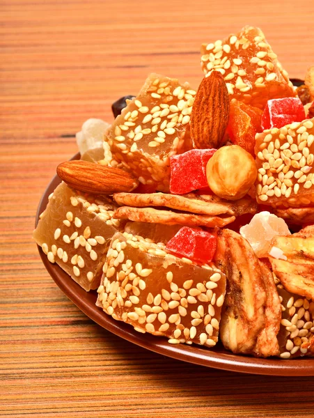 Turkish sweet delights with sesame, dried bananas, candied fruit — Stock Photo, Image