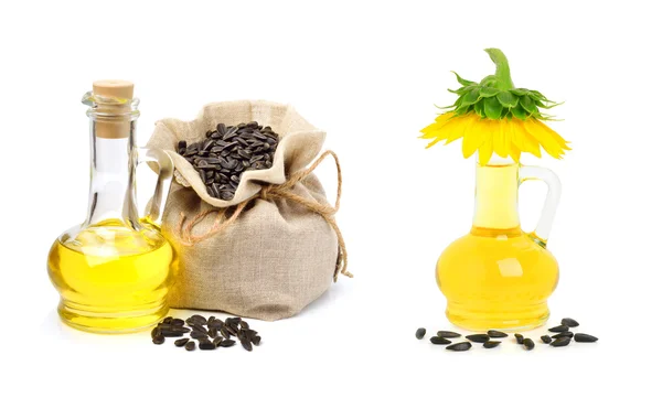 Carafe with vegetable oil and bag with sunflower seeds — Stock Photo, Image