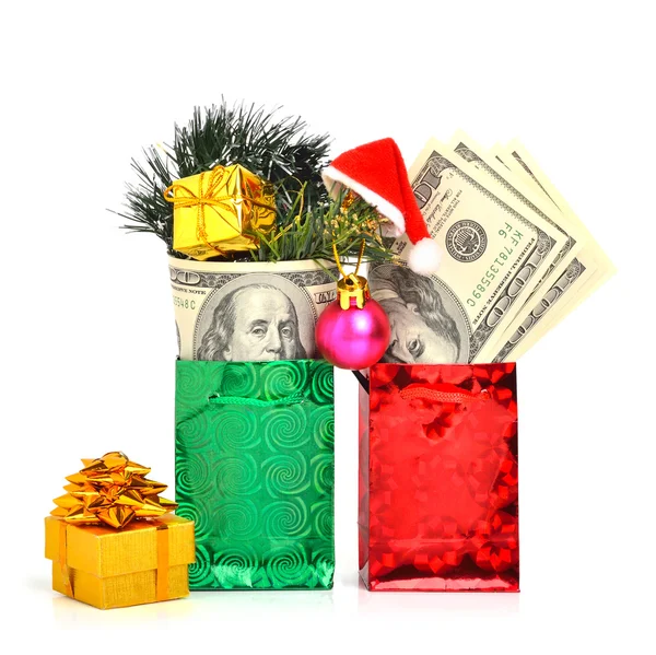 Hundred dollars gift in the package with christmas hat, bauble and pine twig isolate on white. Christmas — Stock Photo, Image