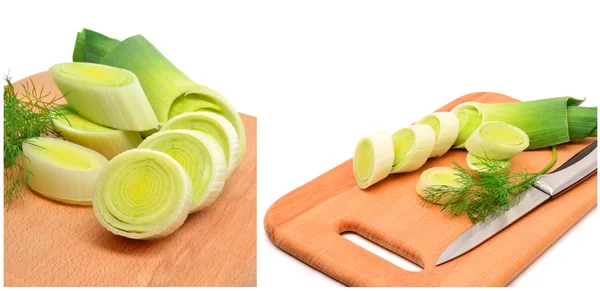 Fresh sliced leeks and dill on a wooden board — Stock Photo, Image