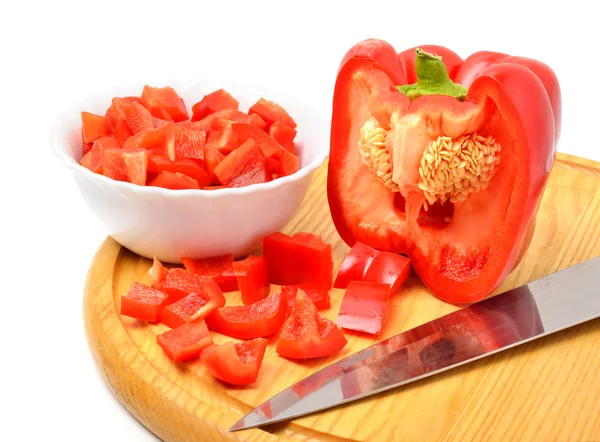 Fresh chopped bell pepper with a knife blade on cutting board — Stock Photo, Image