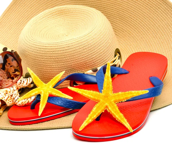 Red flip flops with starfishes, sunglasses and a seashell isola — Stock Photo, Image