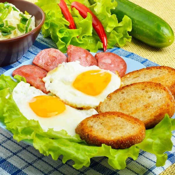 English breakfast - toast, egg, bacon and vegetables