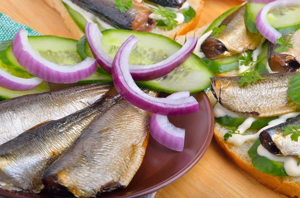 Sandwich with sprats and green cucumber — Stock Image Sandwich with sprats and green cucumber Stock Photo