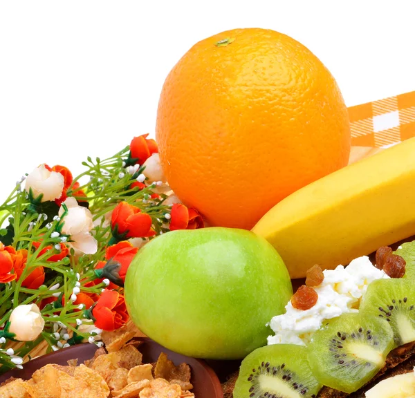 Healthy food. Fresh fruit and dry loaves with curd on a wooden b — Stock Photo, Image