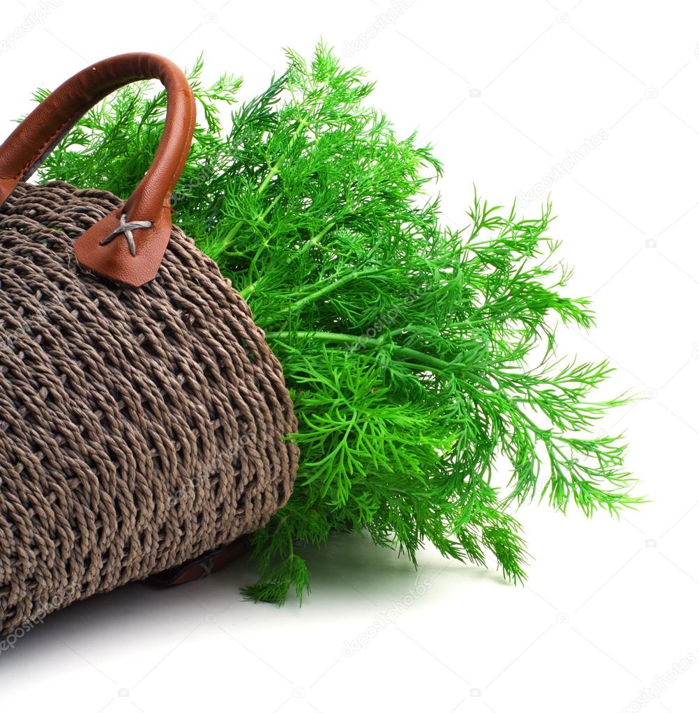 Dill in the wicker basket isolated on white background Stock Photo by