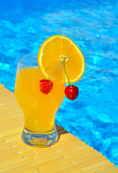 Cocktail glass with orange and cherry — Stock Photo, Image