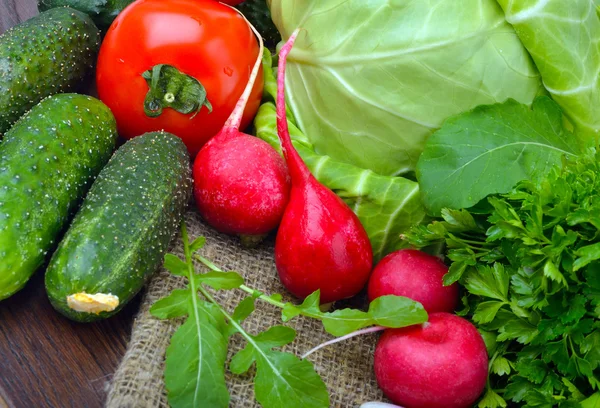 Composition with raw vegetables on sacking — Stock Photo, Image