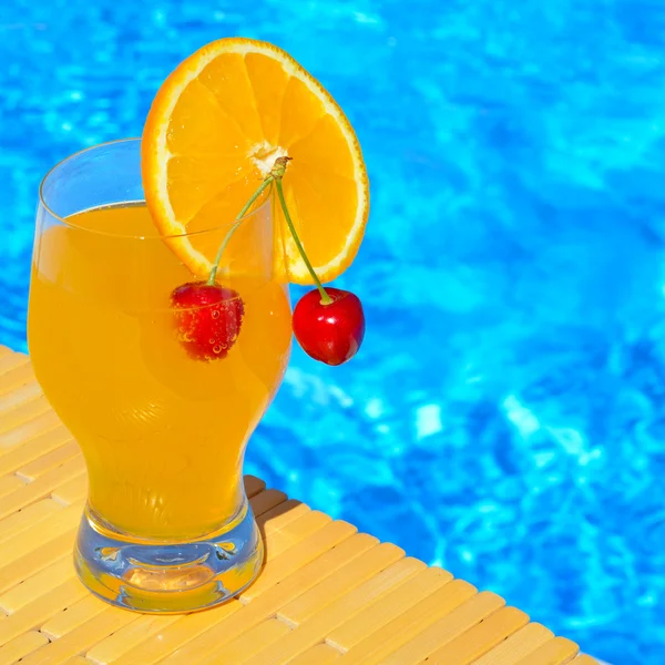 Cocktail glass with orange and cherry — Stock Photo, Image