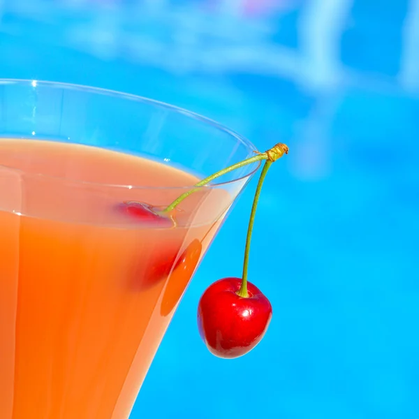 Glass of juice and a cherry — Stock Photo, Image