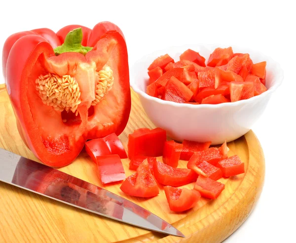 Fresh chopped bell pepper with a knife blade on cutting board — Stock Photo, Image