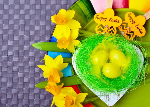 Daffodils and decorative heart. — Stock Photo, Image