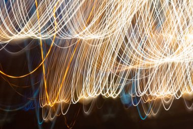 Abstract long exposure lights on the street. abstract blurred light trail. Abstract, Night lights illuminate the street