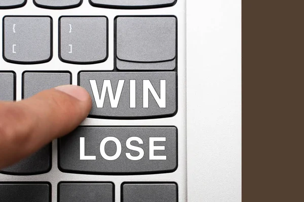 choice: win or lose. the buttons of pc keyboard with words win and lose. man chooses victory over defeat concept.