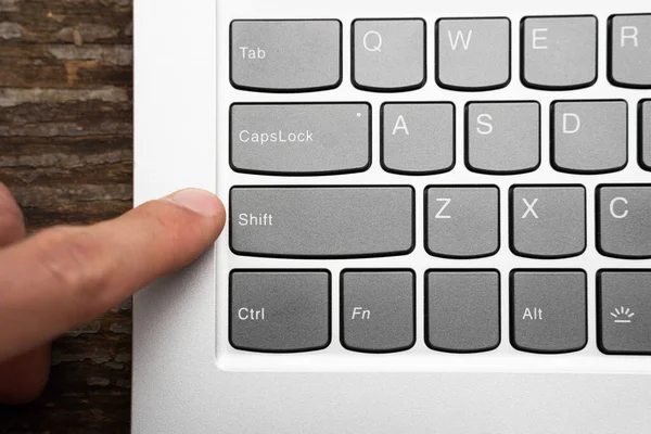 Finger Reaches Out Press Shift Key Computer Keyboard — Stock Photo, Image