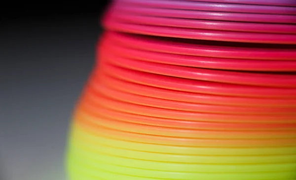 Plastic colored rainbow texture. Toy rainbow.