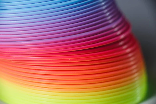 Plastic colored rainbow texture. Toy rainbow.